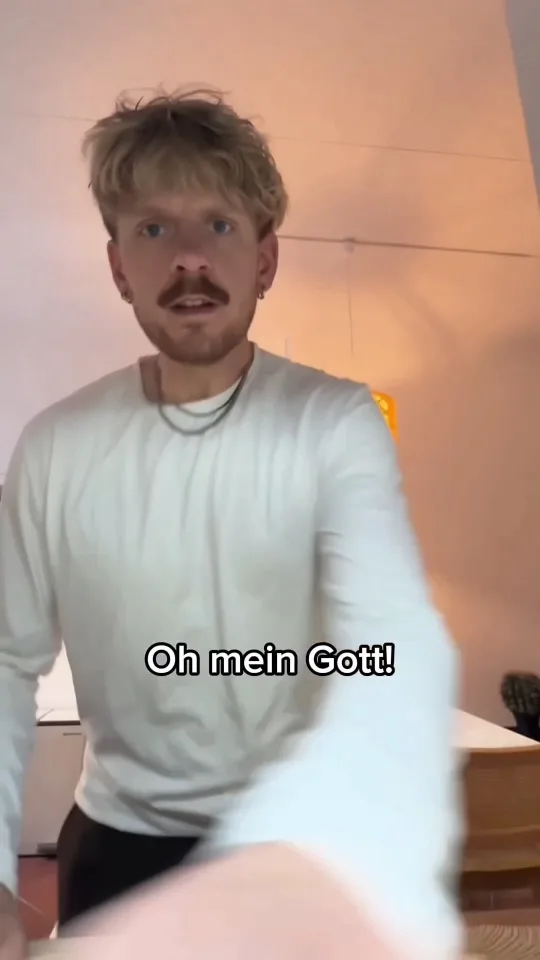 UGC ad for a mobile game: creator reacting in shock with the caption "Oh mein Gott!"