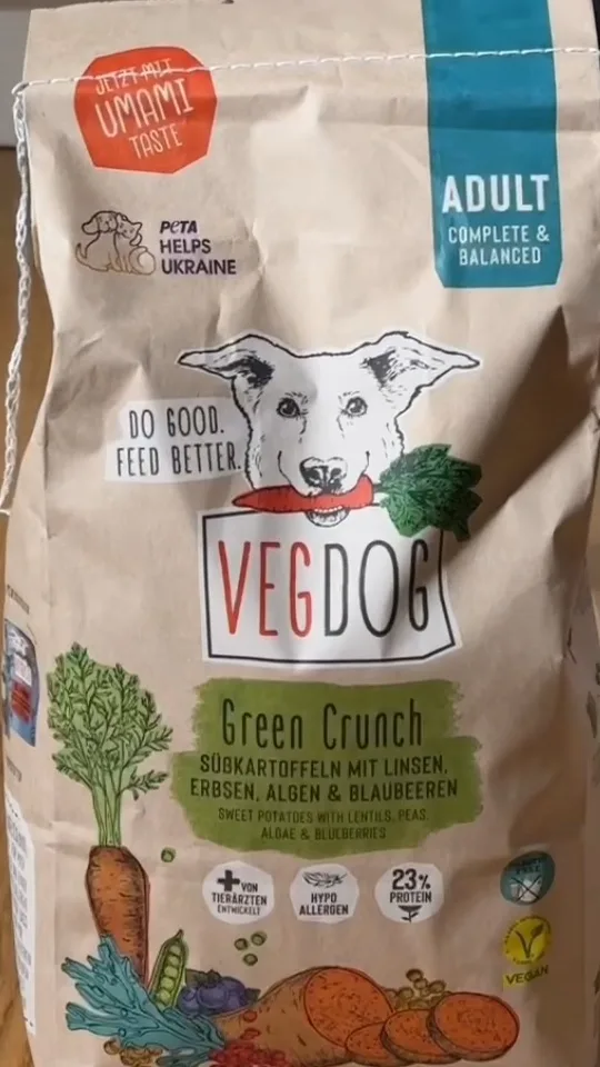 UGC ad for a pet food brand: close-up of a VEGDOG Green Crunch dog food bag