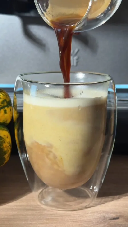The same video: coffee poured into a double-walled glass